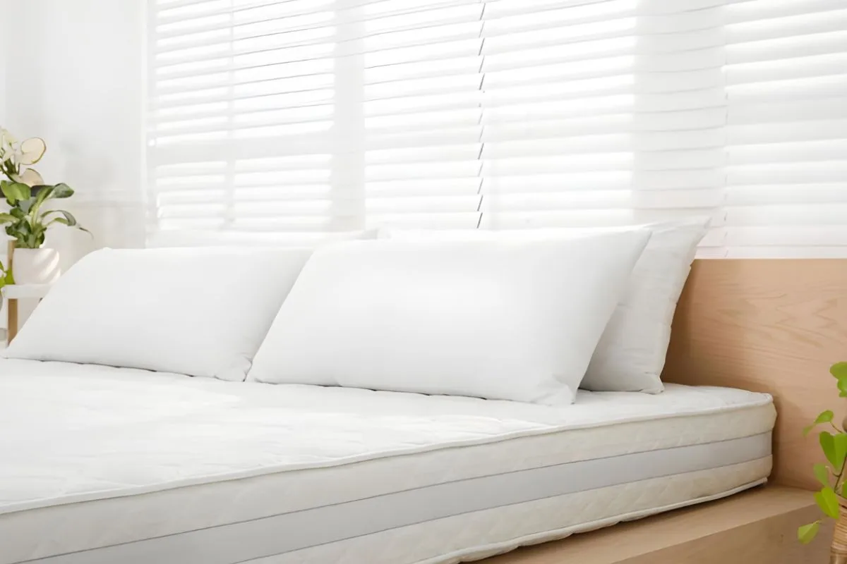 Medium soft mattress with plush white bedding showing a balance of cushioning comfort and gentle support for sleepers