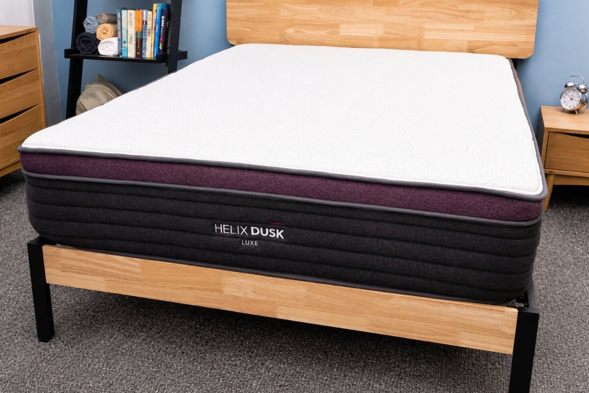 helix dusk luxe mattress with ergonomic support design displayed on a wooden bed frame