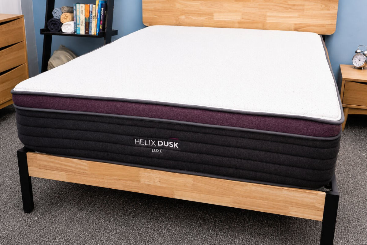 helix dusk luxe mattress with ergonomic support design displayed on a wooden bed frame