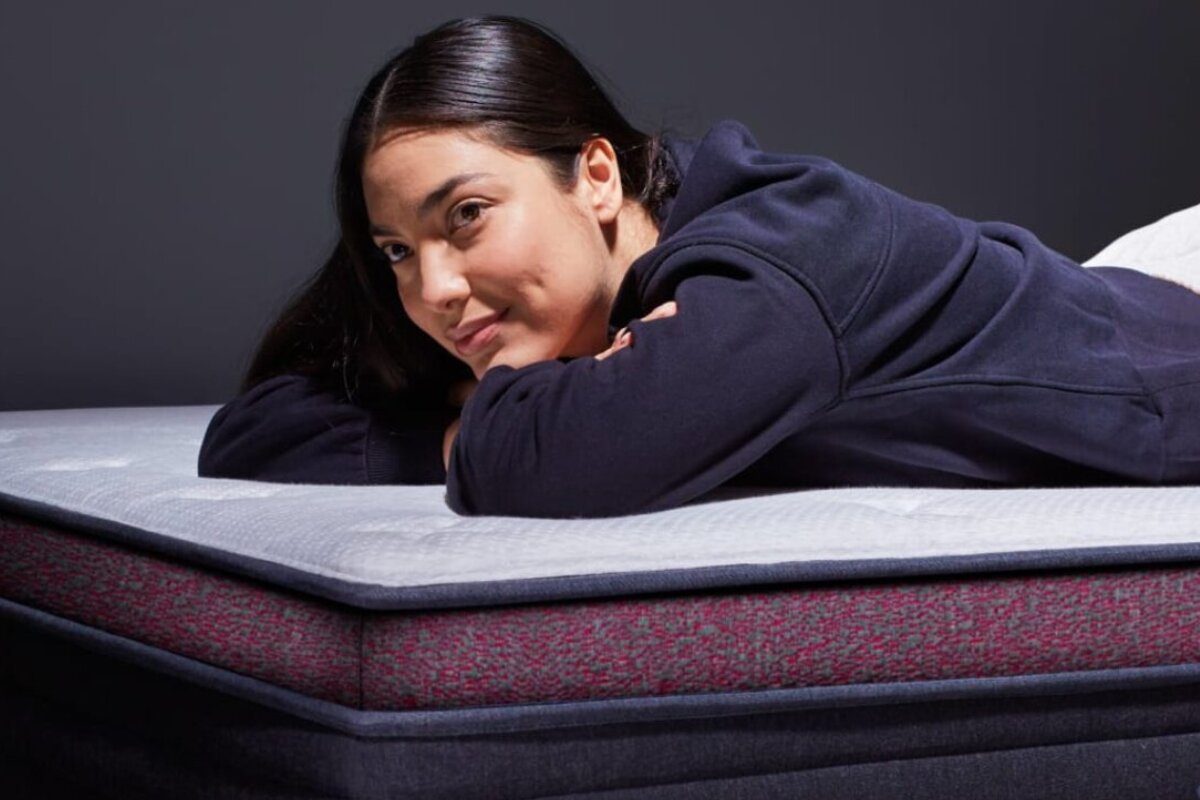 person lying comfortably on the helix dusk luxe mattress showcasing pressure relief and support