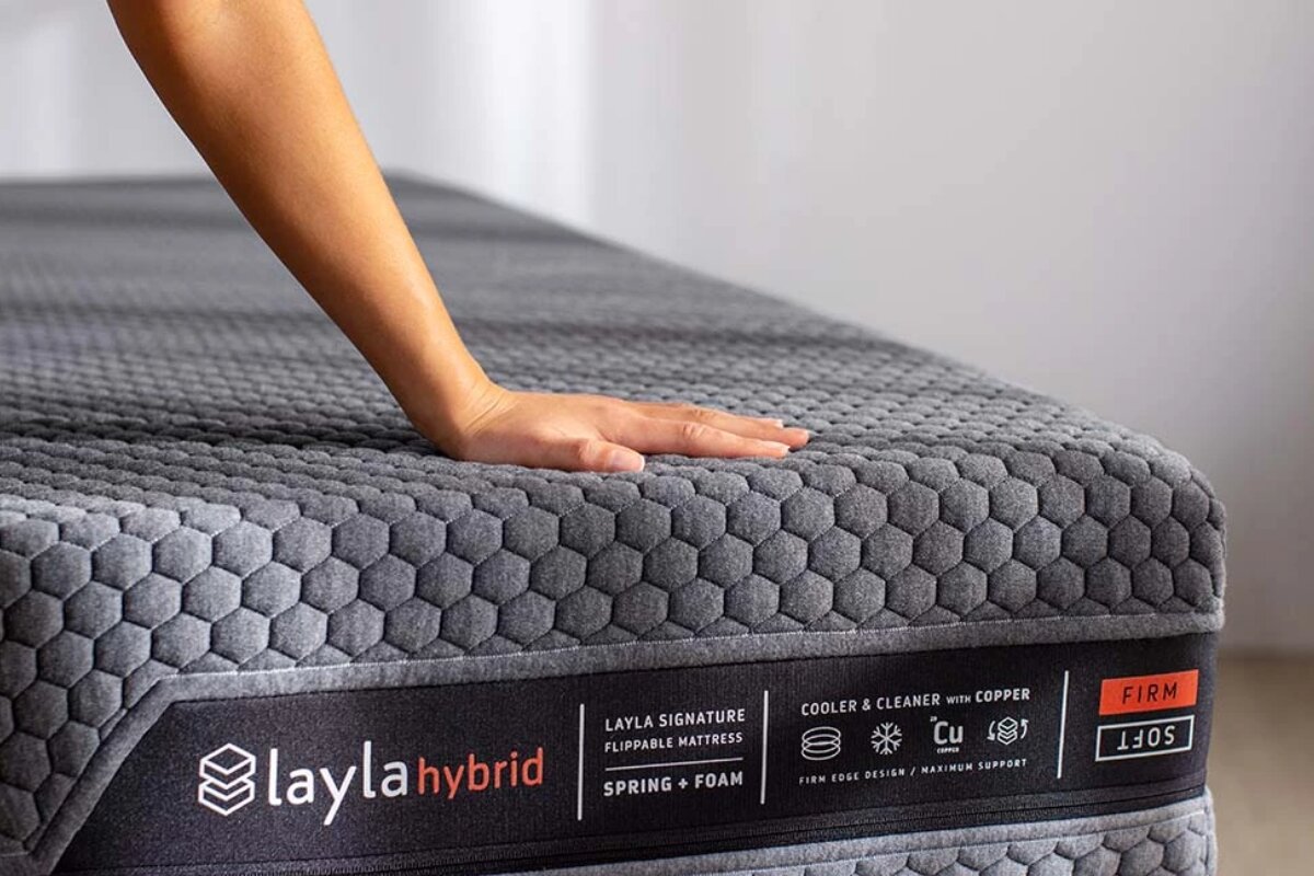 A person pressing on the Layla Hybrid Mattress.