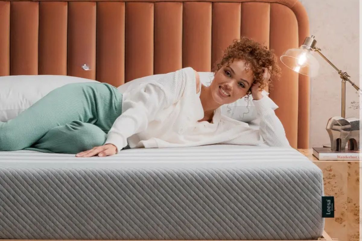 Woman lying on a Leesa Original Mattress demonstrating pressure relief and comfort during everyday use