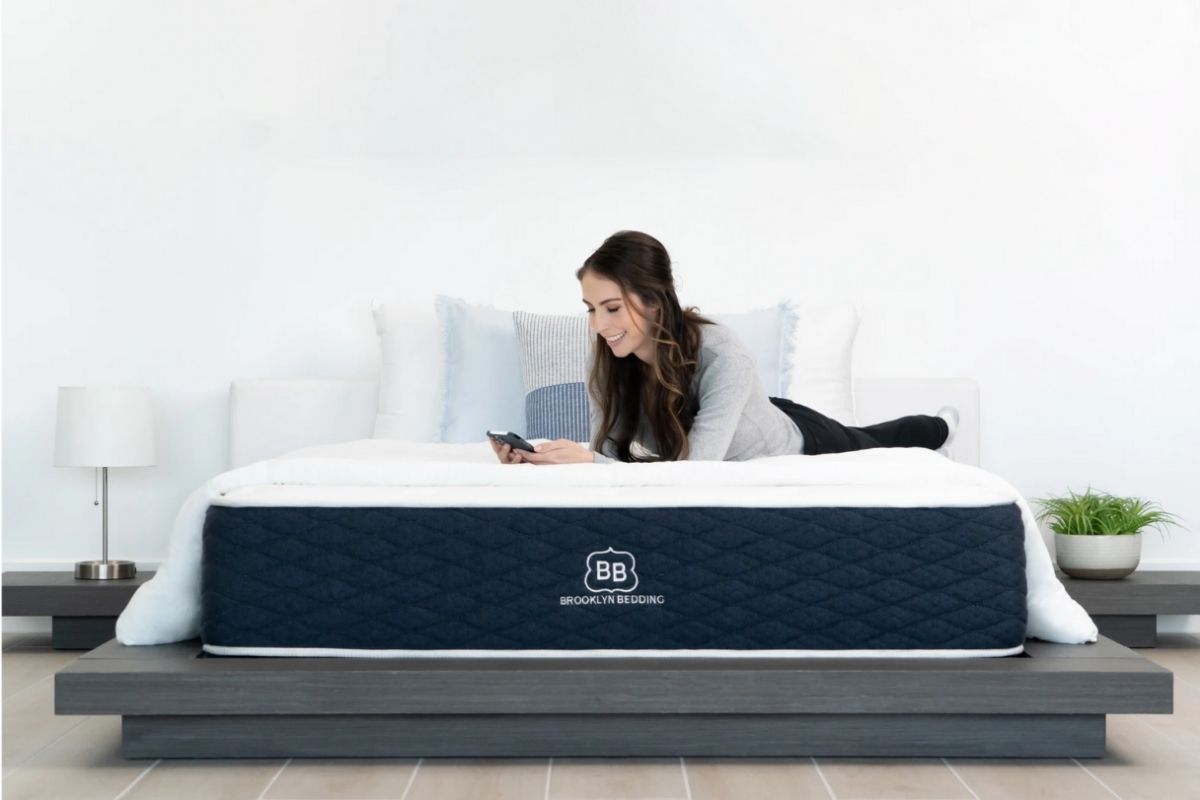 Sleeper relaxing on a supportive mattress highlighting the importance of mattress comfort for lower back pain relief
