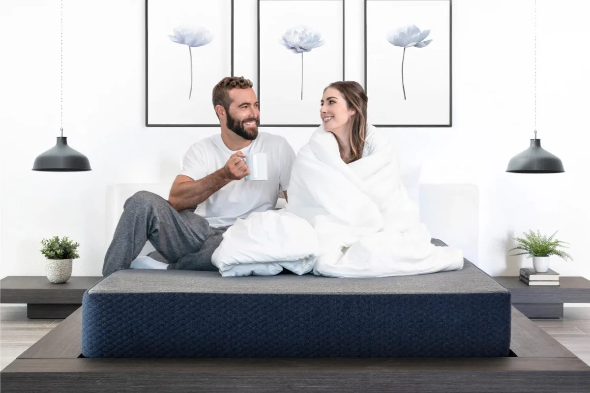 Couple relaxing on a Dreamfoam Essential mattress demonstrating the clean and comfortable sleep environment discussed in the mattress safety guide