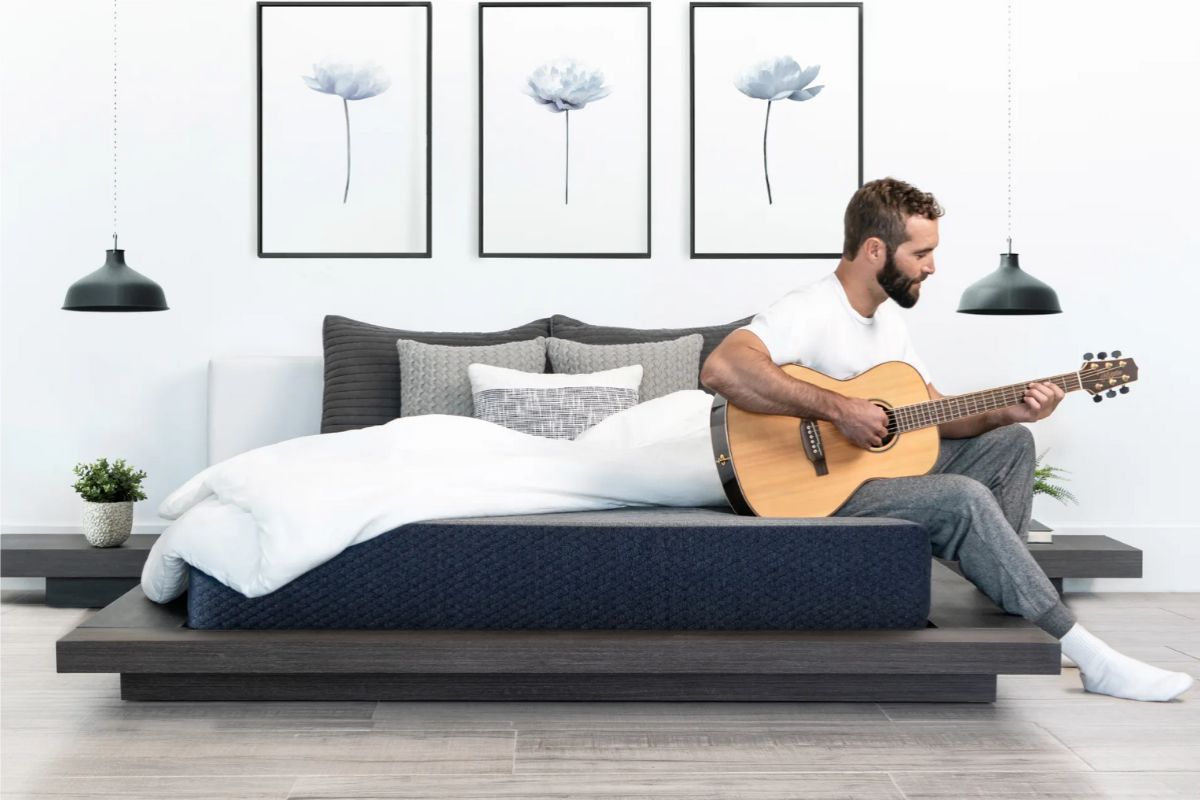 Person relaxing on a Dreamfoam Essential mattress during the sleep trial period to test comfort and support at home