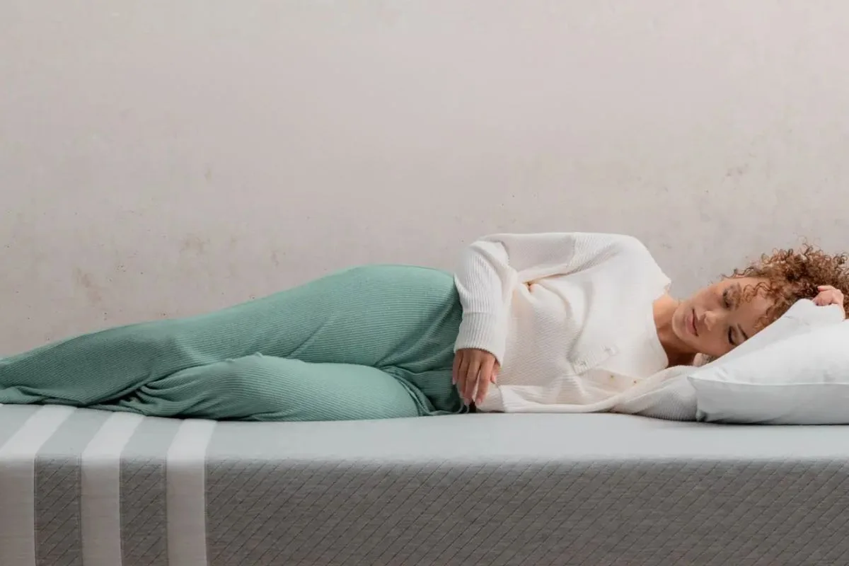 Side sleeper resting on a Leesa Original Mattress showing body contouring and motion isolation performance
