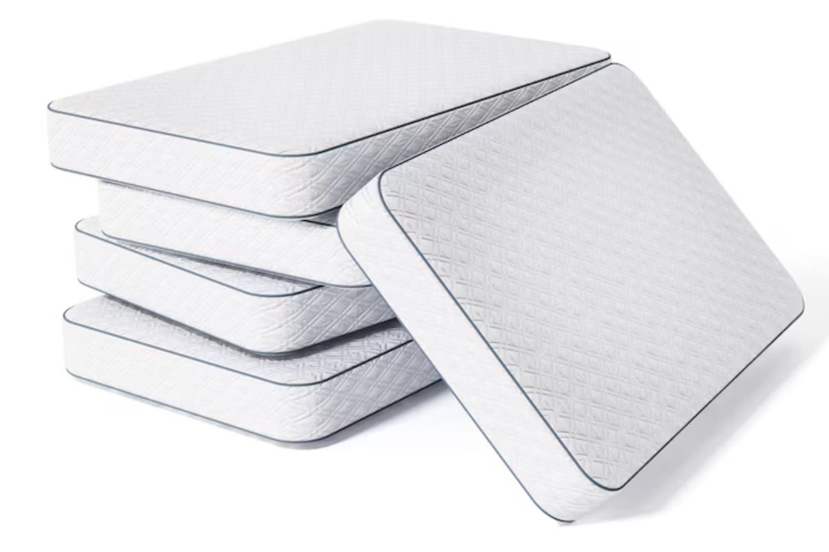Stack of mattresses illustrating different firmness options including medium soft and medium firm mattress types