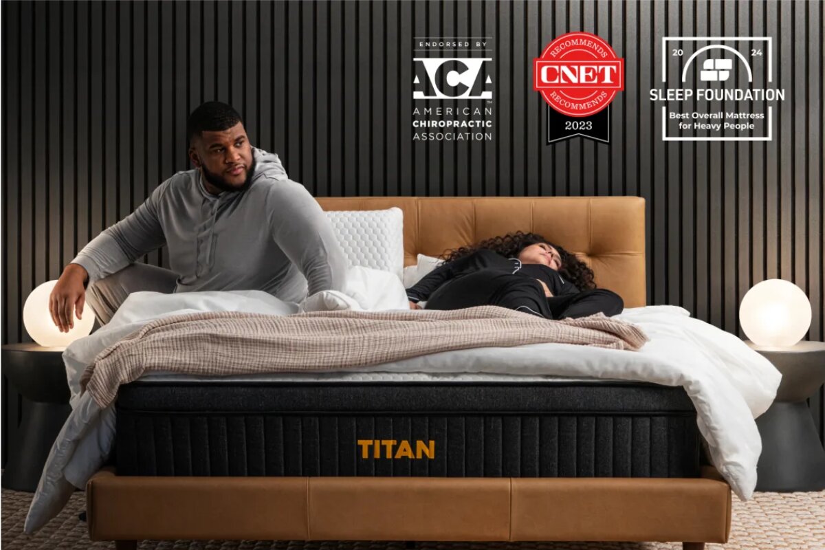 A couple resting on the Titan Plus Luxe mattress with accolades from the American chriopractic association, CNET, and Sleep Foundation.