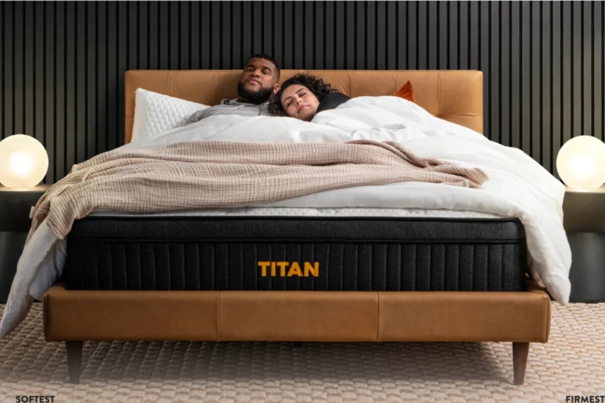 A couple sleeping on the Titan Plus Luxe mattress.