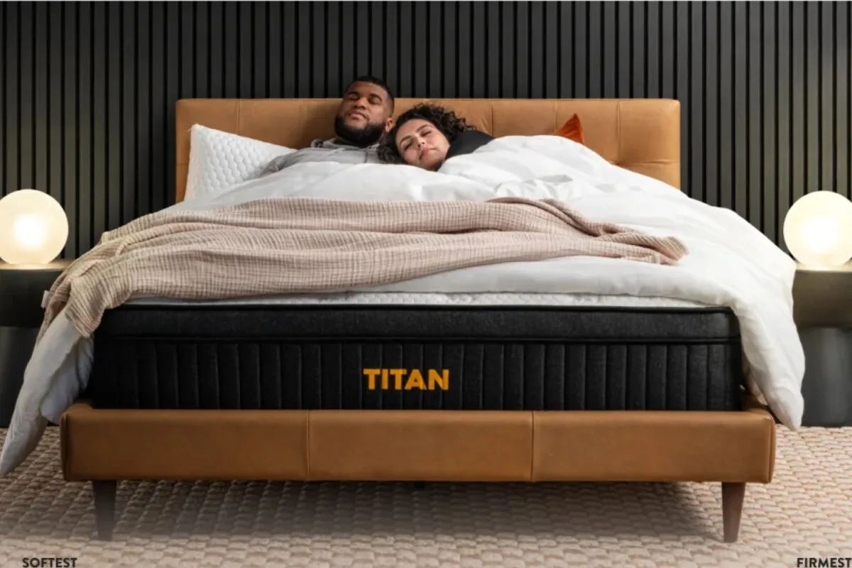 A couple sleeping on the Titan Plus Luxe mattress.