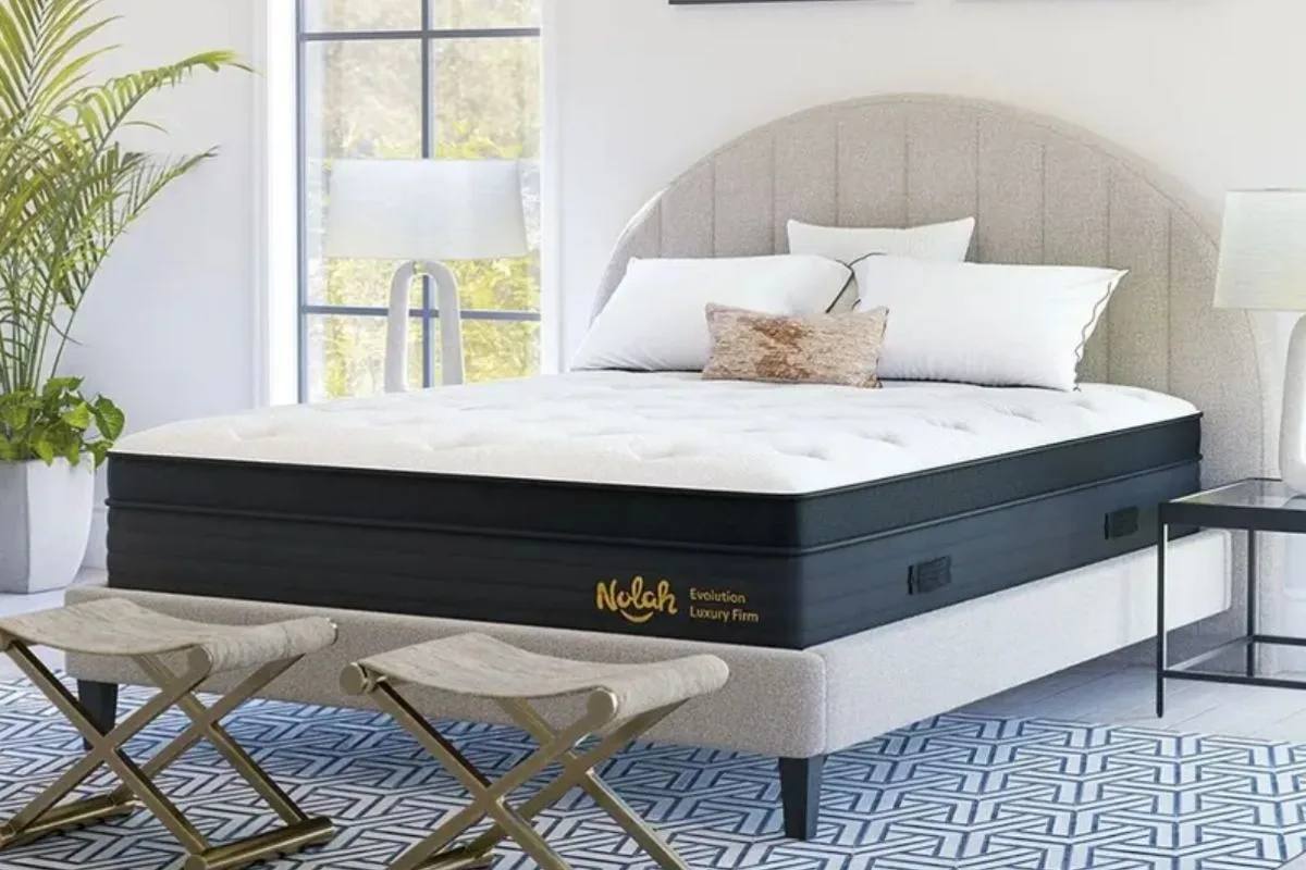 Sleep Deprivation: Causes, Effects, and Solutions for Better Sleep Nolah Evolution hybrid mattress in a bright bedroom highlighting the importance of a supportive mattress for better sleep quality