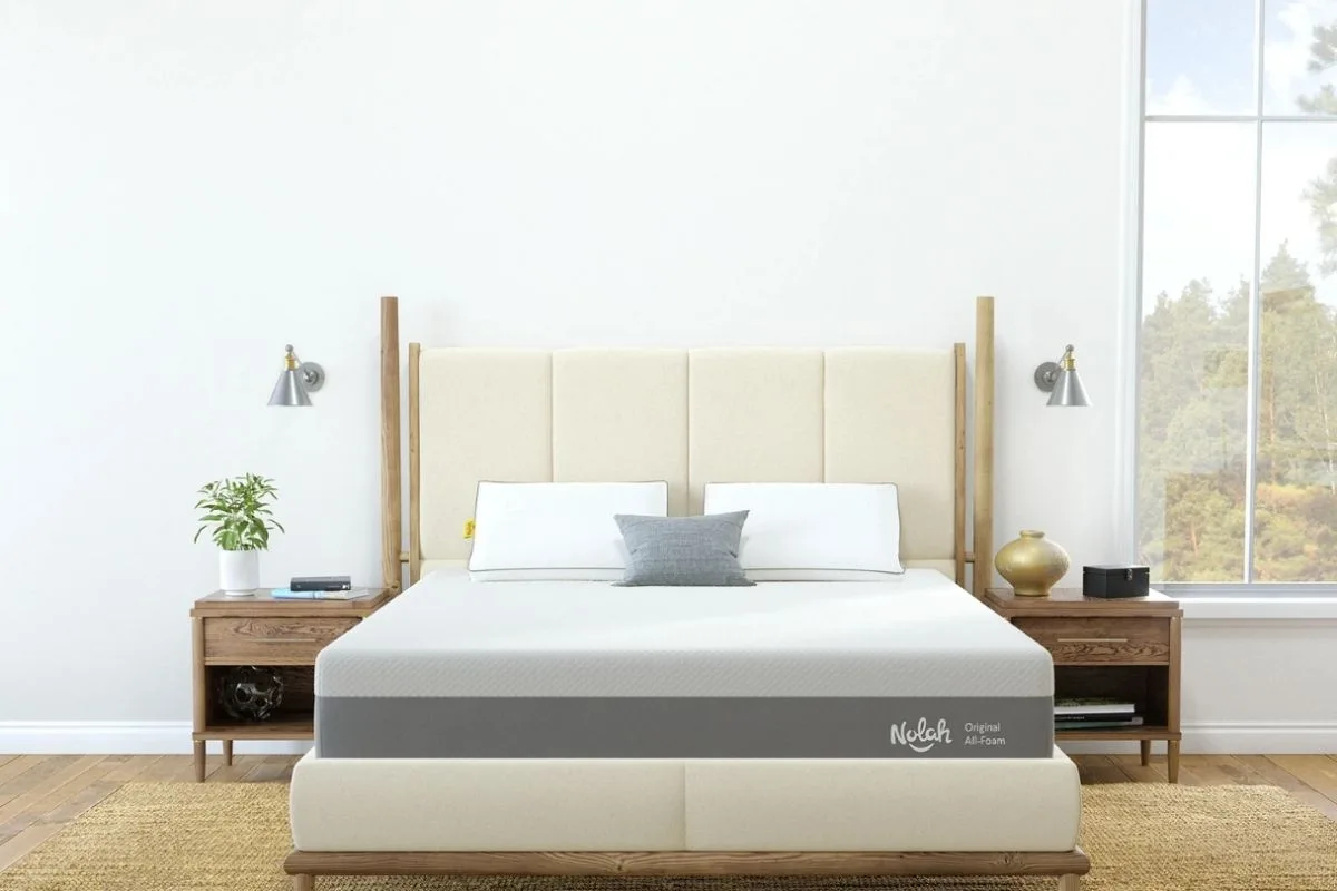 Is 5 Hours of Sleep Enough? Understanding the Health Implications Comfortable mattress in a bright bedroom, representing the importance of a supportive sleep environment for achieving healthy sleep and recovery