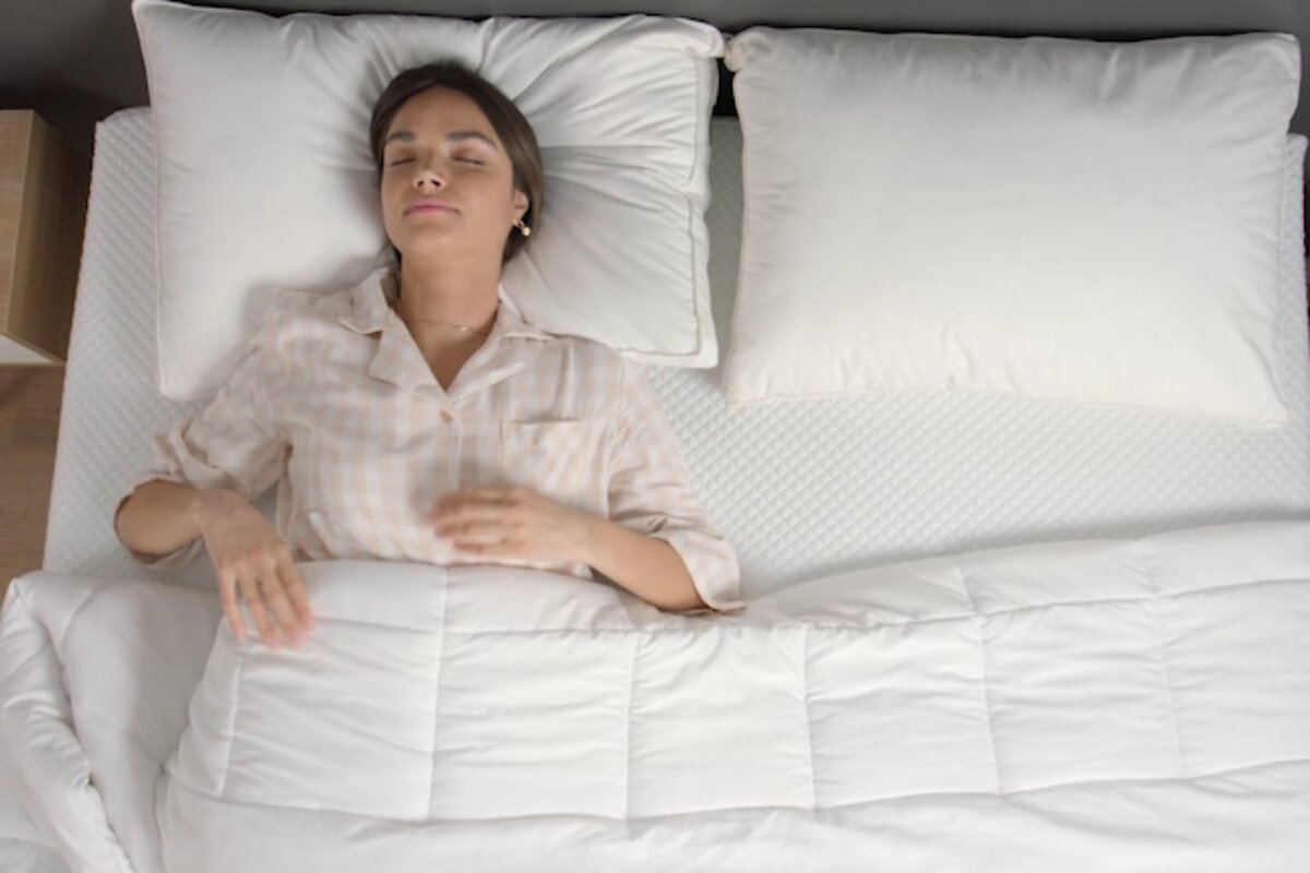 A woman sleeping on a memory foam mattress.