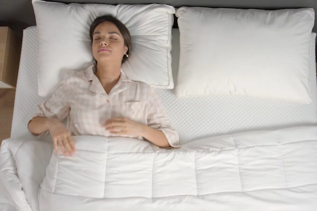 A woman sleeping on a memory foam mattress.