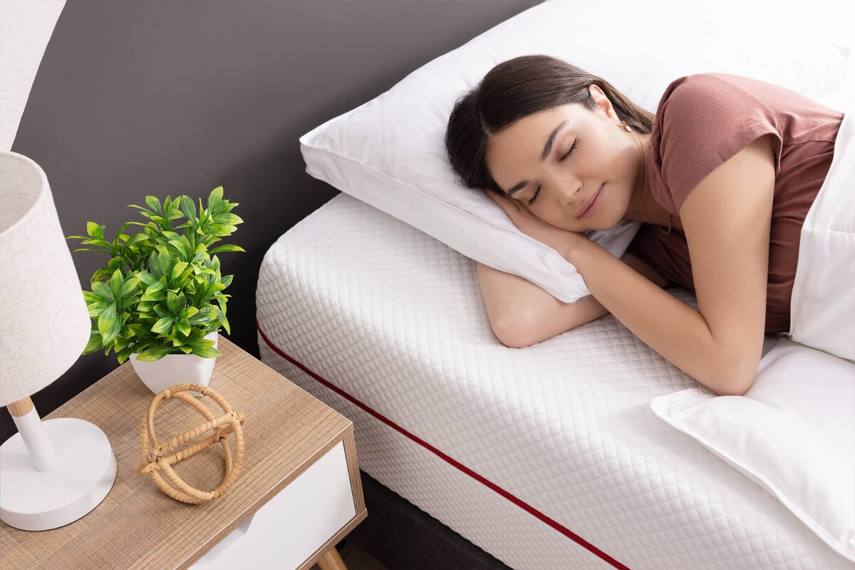 A woman sleeping on an allfoam bed.