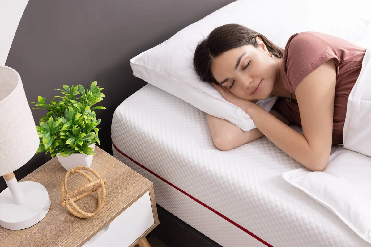 A woman sleeping on an allfoam bed.