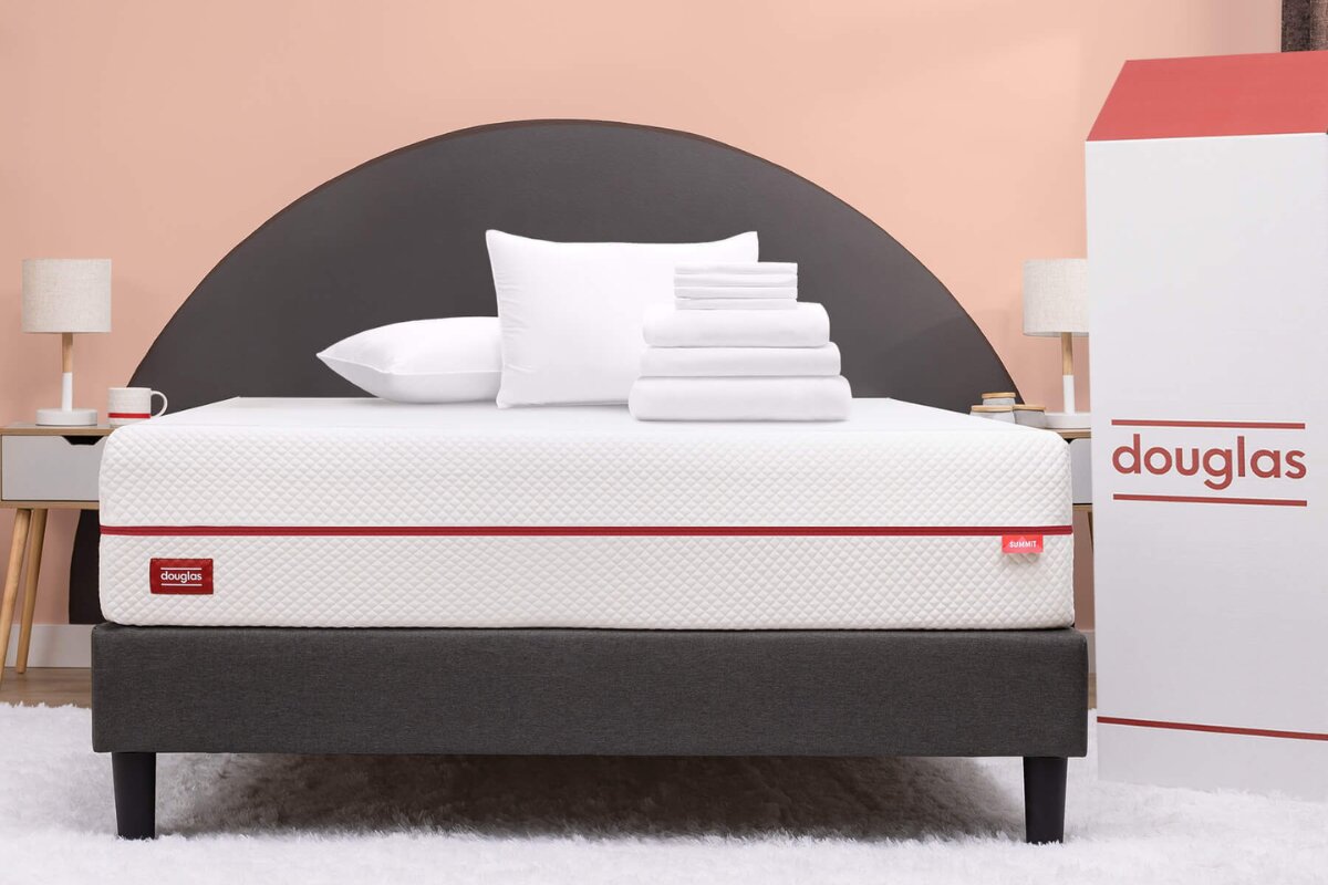 The Douglas Summit Mattress with the delivery box nex to the bed.