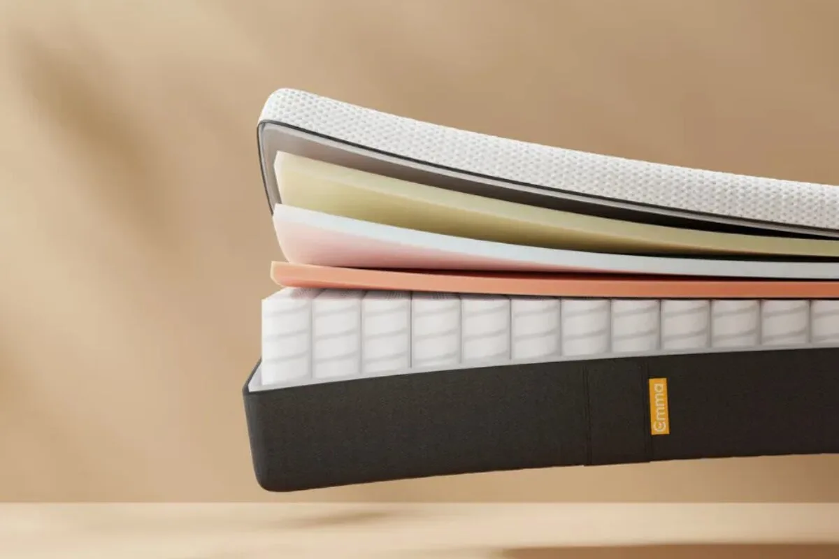 emma elite mattress cutaway showing layered foam and pocket spring support system for pressure relief and stability