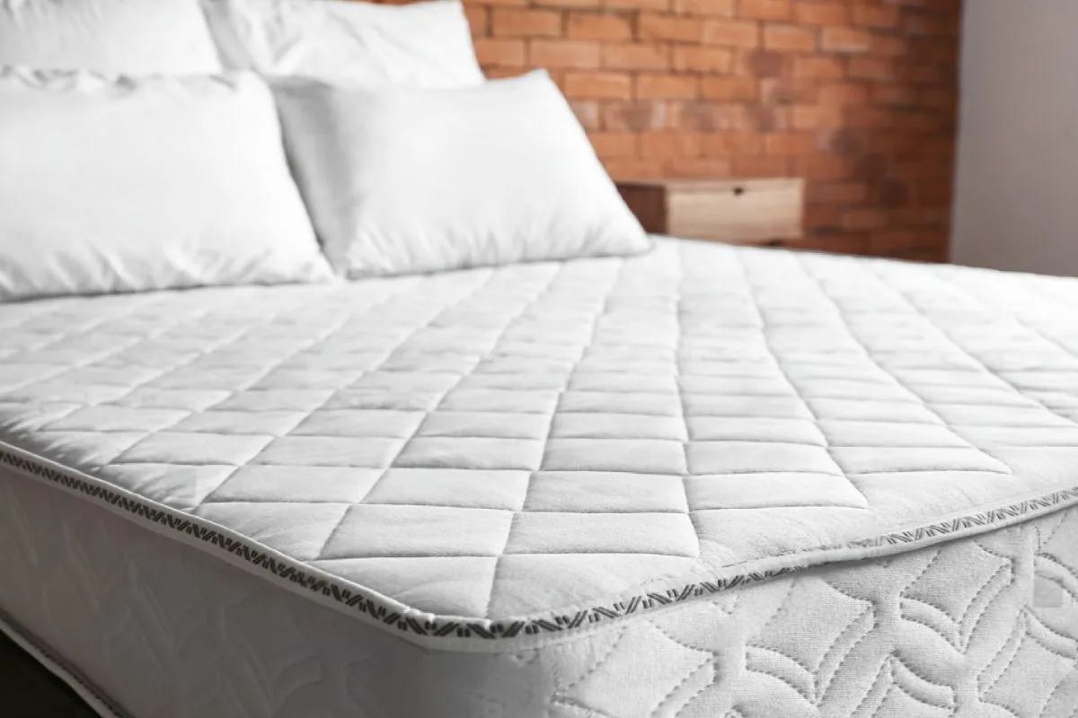 Clean, dry mattress with a mattress protector installed to help prevent future moisture damage and stains