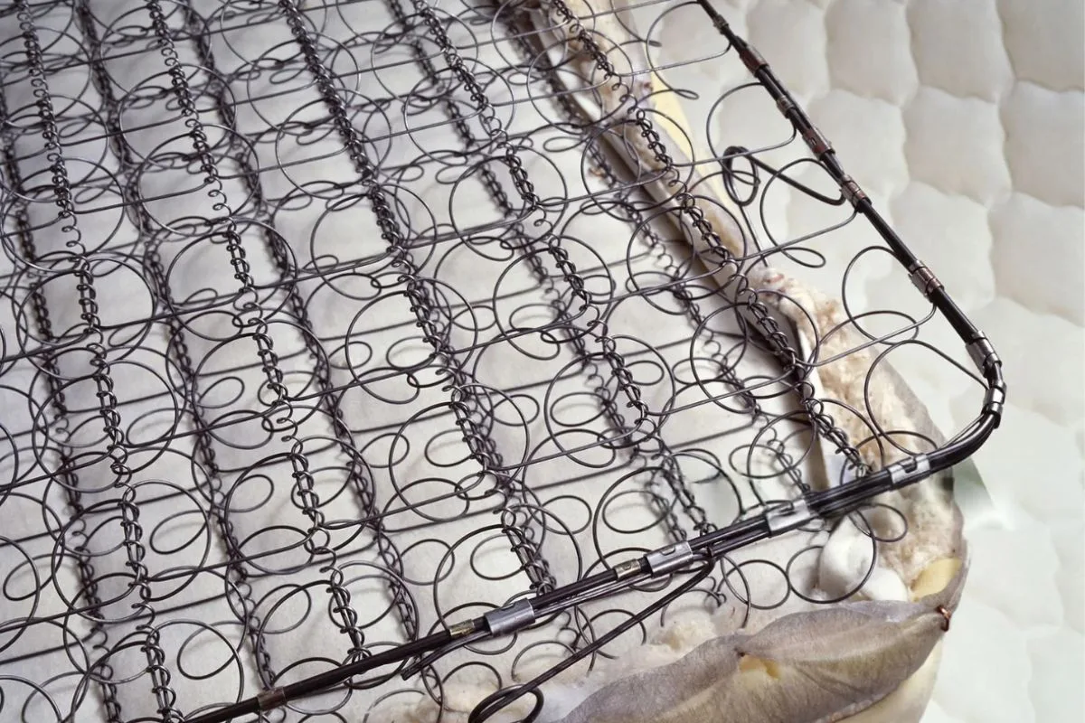 Exposed innerspring mattress coils showing the support core, illustrating what to look for in coil construction and durability