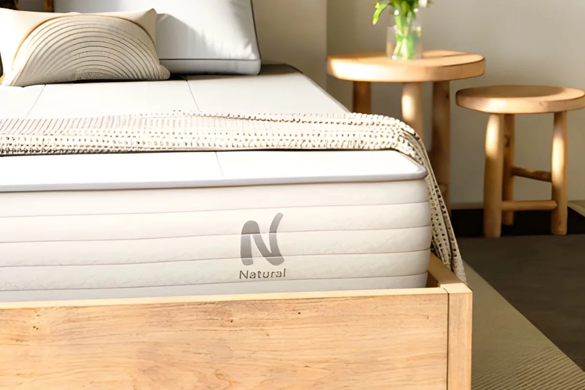 Nolah Natural 11 mattress displayed in a bedroom setting, illustrating the eco-friendly sleep environment offered by this natural hybrid mattress