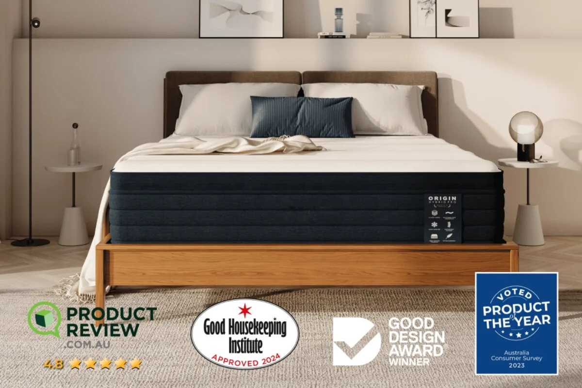 The Origin Hybrid Pro Mattress on a bed frame with all of the accolades: Product review.com.au, Good Housekeeping Institute, Good Design Award Winner and Voted Product of the year.