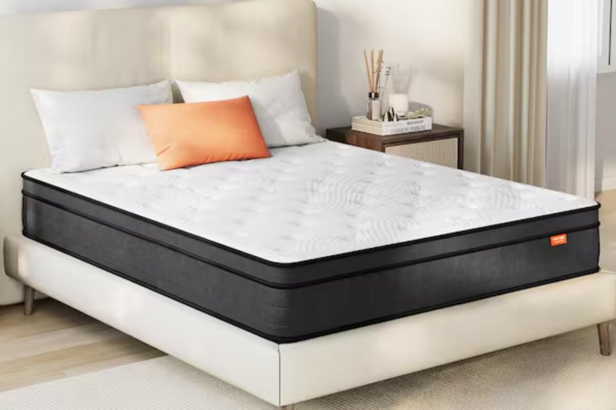 The SweetNight Twilight Hybrid Mattress on a bedframe.