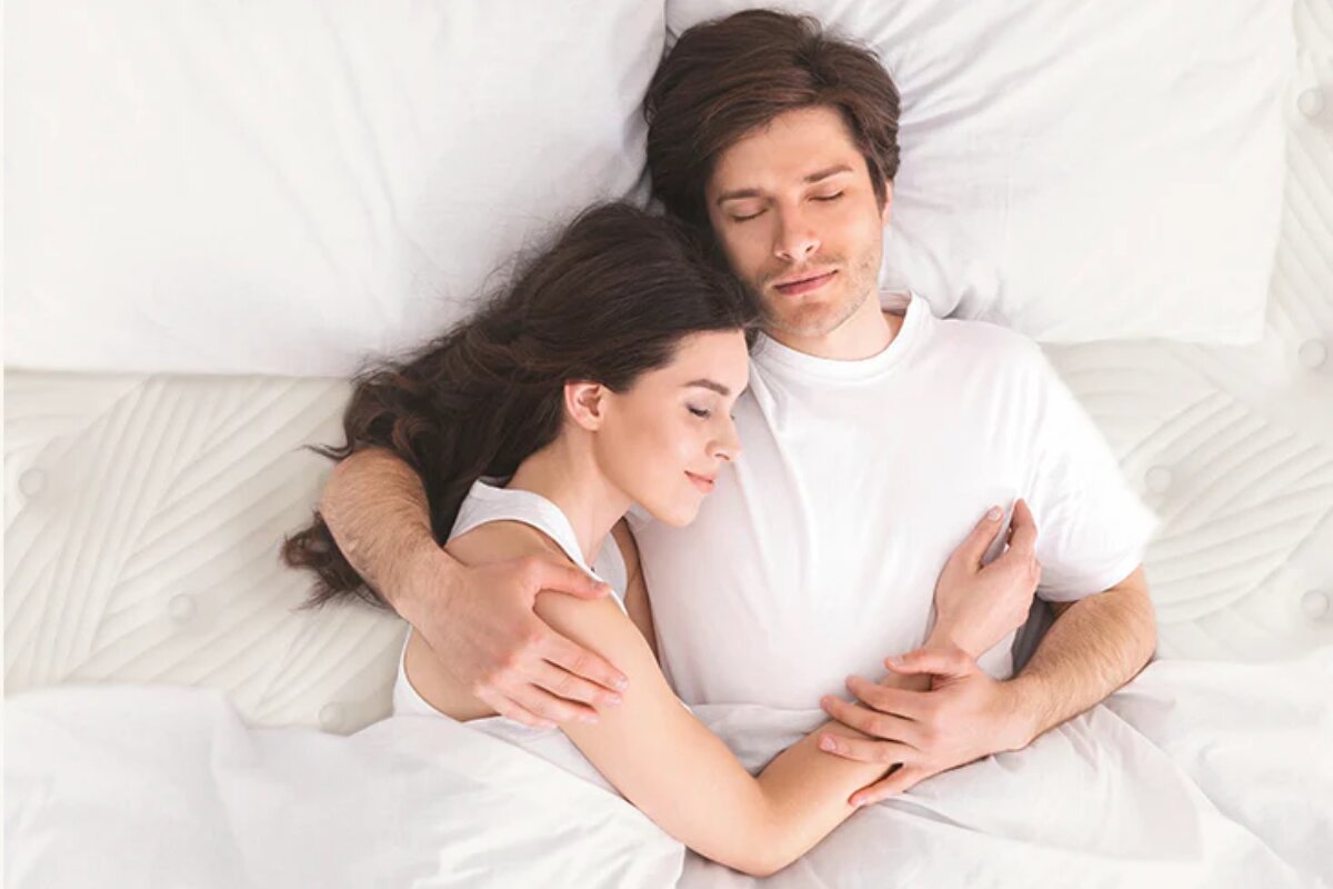 A couple sleeping on a hybrid bed.