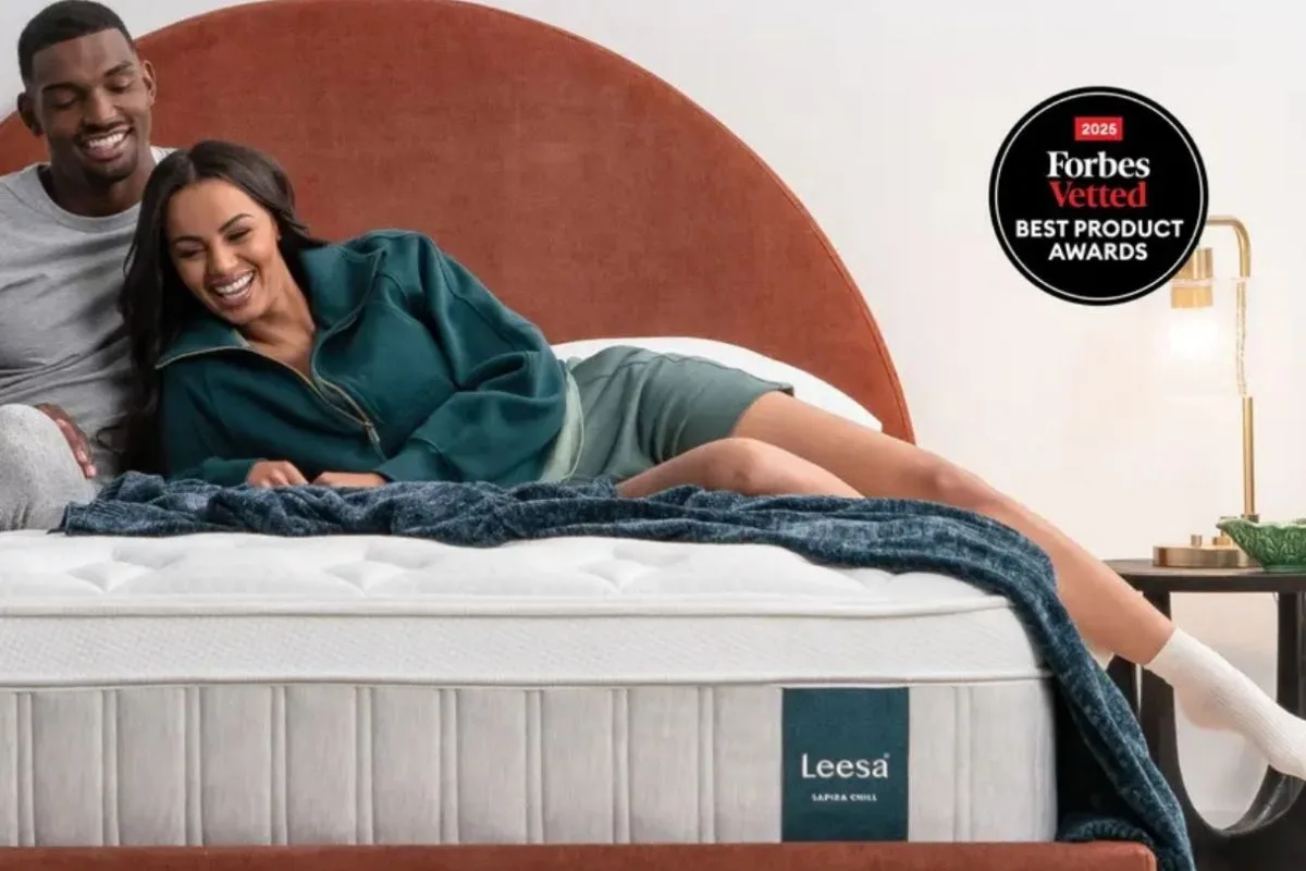 How to Sleep with Scoliosis: Best Sleep Positions and Tips Couple relaxing on a supportive hybrid mattress, highlighting the role of proper mattress support in improving sleep quality for people with scoliosis