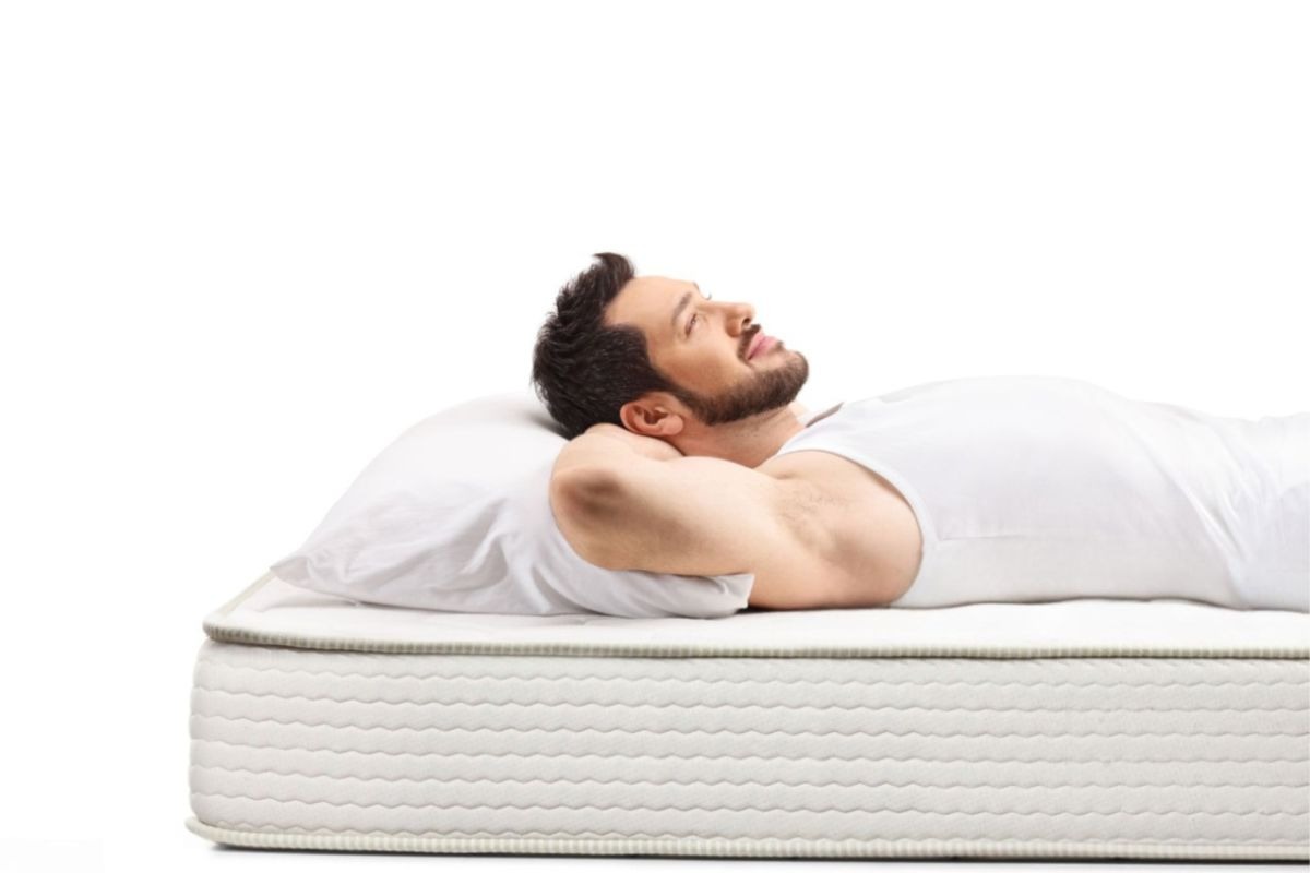 Sleeper resting comfortably on a mattress, illustrating how mattress type can affect pressure relief, support, and overall sleep comfort