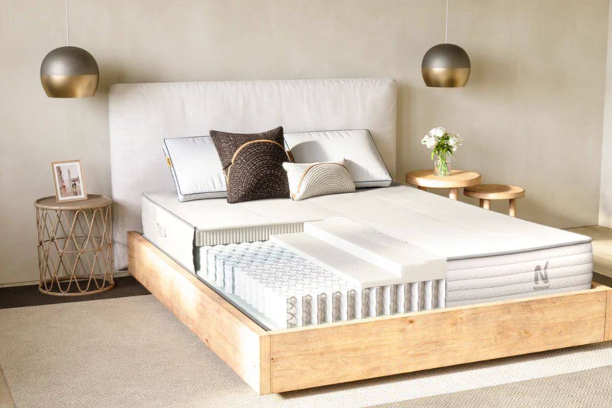 Cutaway view of the Nolah Natural 11 mattress showing its latex and coil construction, emphasizing the importance of proper support and care to maintain warranty coverage