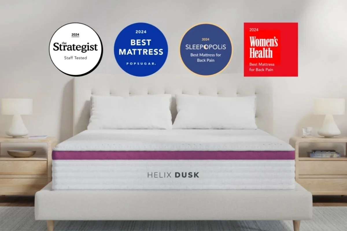 Oversleeping: Understanding Its Causes and Health Implications Helix Dusk mattress displayed with industry awards, suggesting mattress support and sleep quality as factors that may influence sleep duration and comfort
