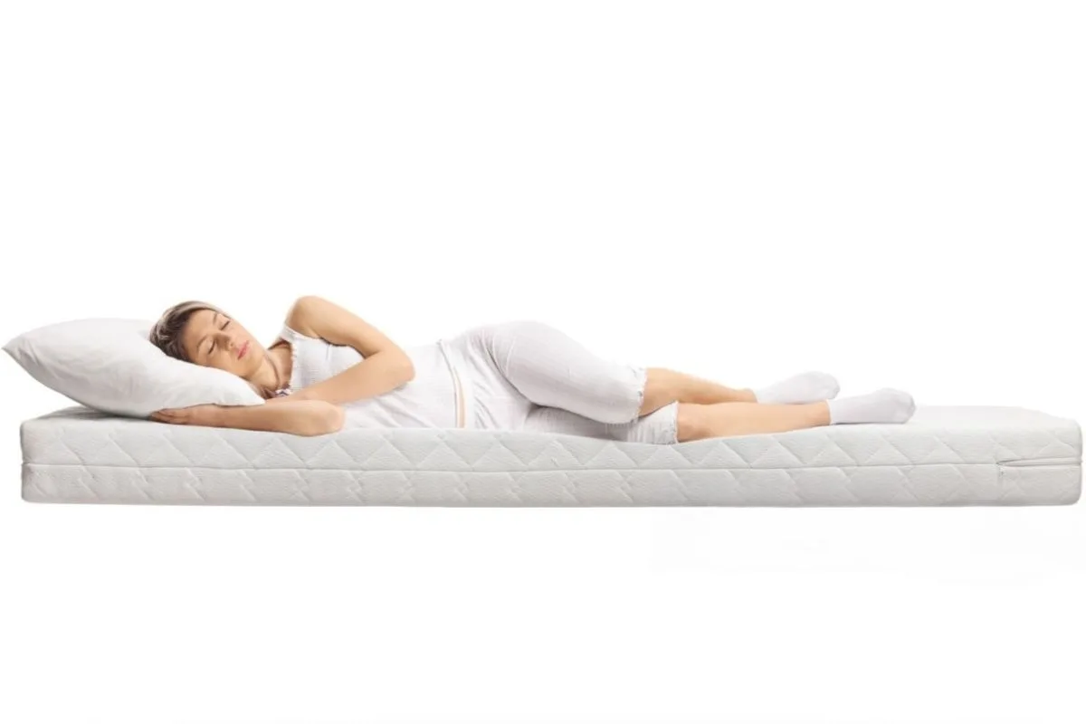 What Is a Latex Mattress? Side sleeper resting on a latex mattress, demonstrating the pressure relief and body-contouring support offered by latex foam