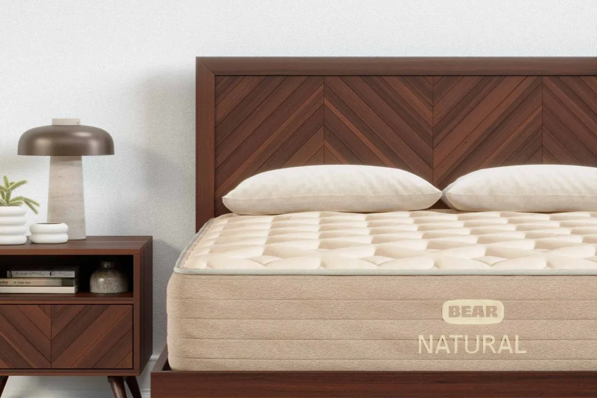 Bear Natural mattress on a wooden bed frame, showcasing the mattress appearance and build quality often mentioned in customer reviews
