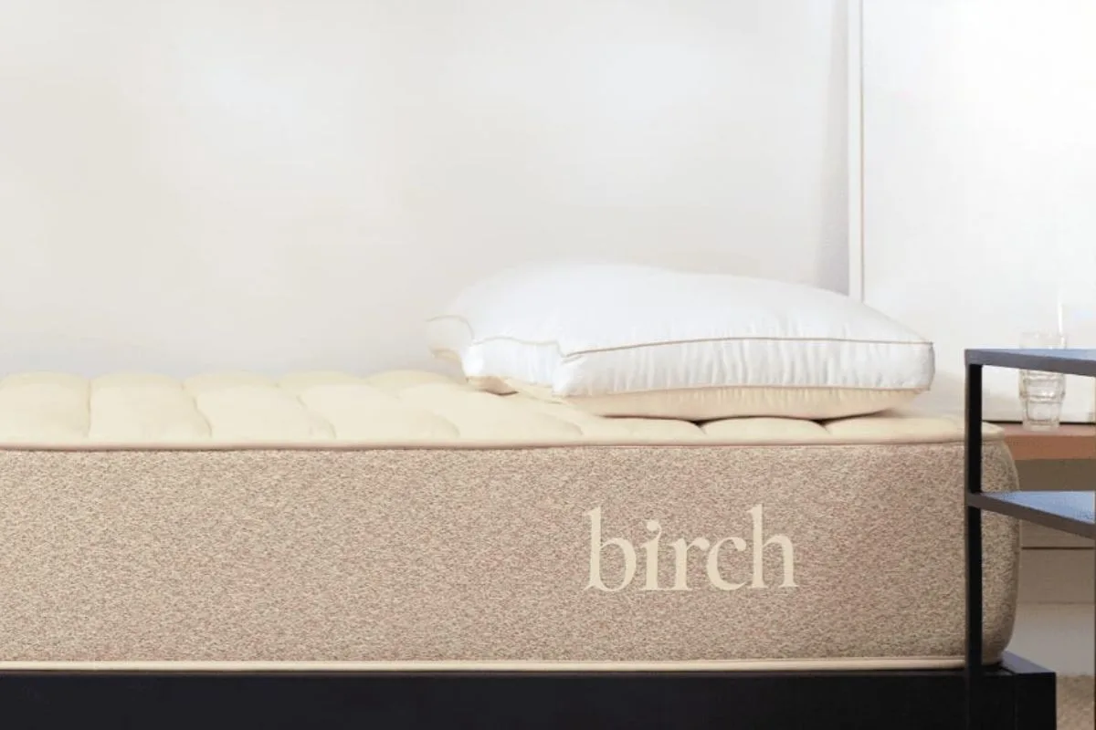 Birch Natural Mattress on a supportive bed frame with a pillow, demonstrating proper mattress setup to help avoid voiding the warranty