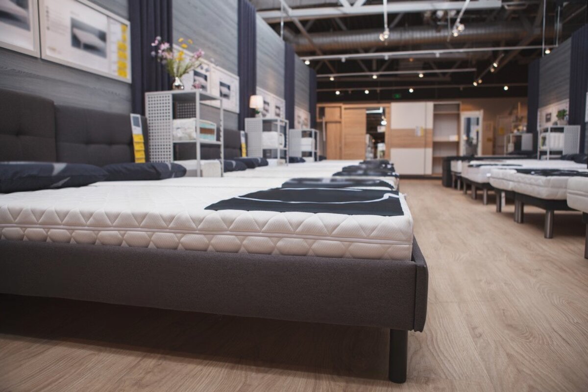 A mattress shop full of mattresses.