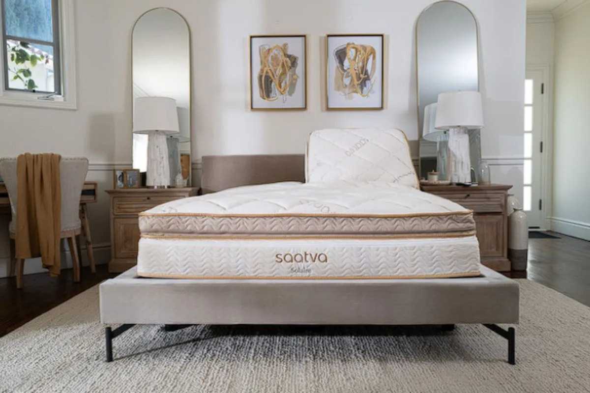 Saatva Solaire Adjustable Firmness Mattress displayed in a bedroom, introducing what to expect during the mattress return process