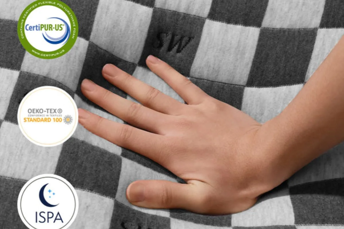 Close-up of the SweetNight Prime Memory Mattress cover with CertiPUR-US, OEKO-TEX, and ISPA certifications highlighting safety and material standards