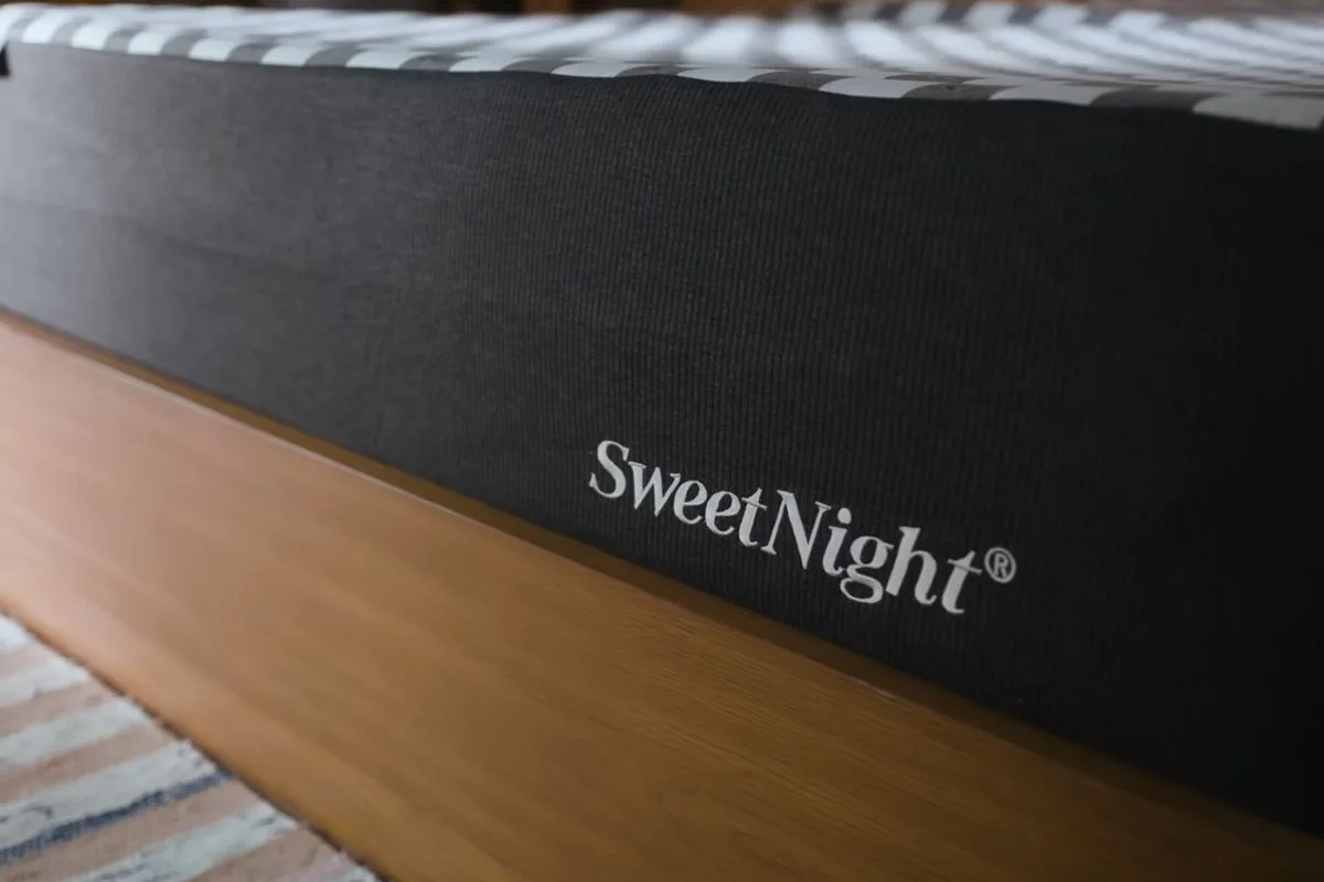 Close-up of the SweetNight Prime Memory Mattress side panel highlighting the premium cover and branding during the return review