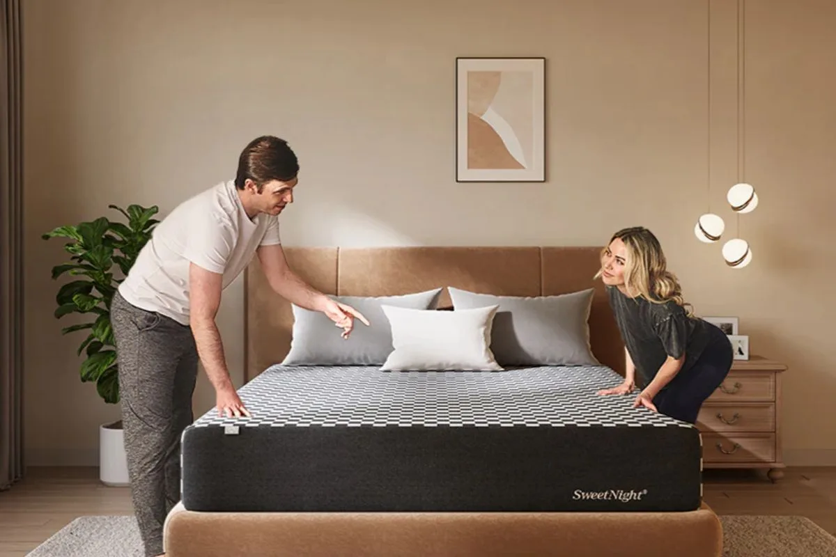 Couple inspecting the SweetNight Prime Memory Mattress during the sleep trial to evaluate comfort and decide whether to keep it
