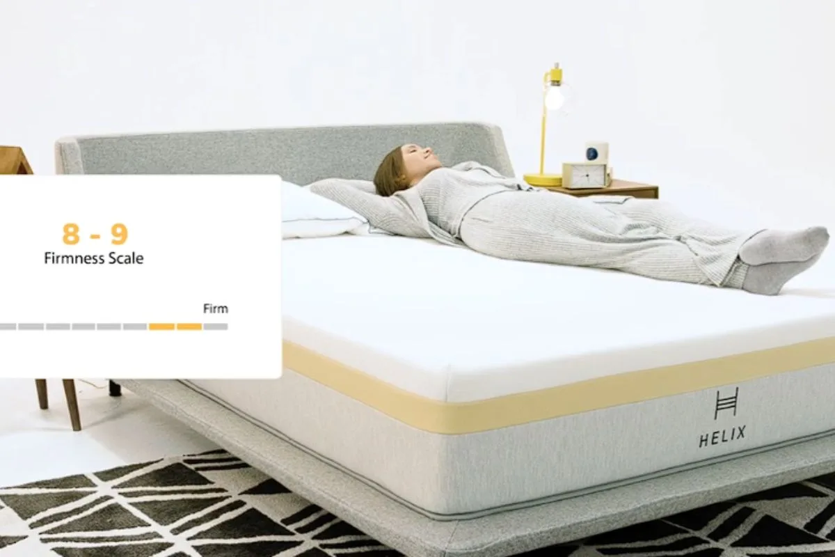 Sleeper testing the Helix Dawn Mattress firmness, demonstrating the firm feel users can experience during the trial period