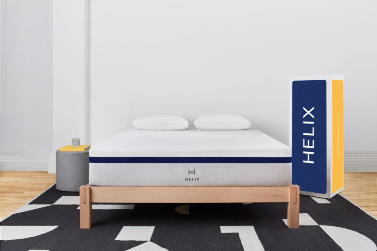 Helix Midnight mattress displayed with its shipping box to illustrate convenient bed-in-a-box delivery