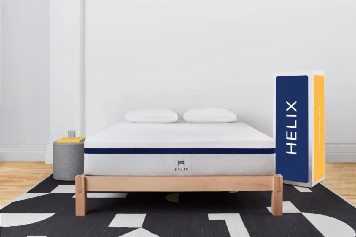 Helix Midnight mattress displayed with its shipping box to illustrate convenient bed-in-a-box delivery