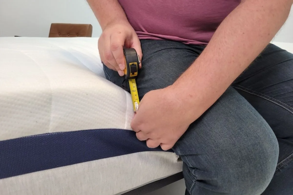 Measuring the Helix Midnight mattress height to compare profile differences with the Helix Midnight Luxe