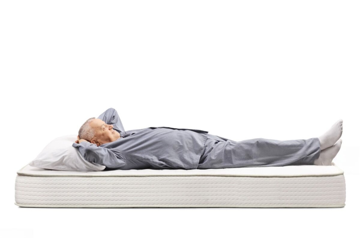 A man lying down on bed.