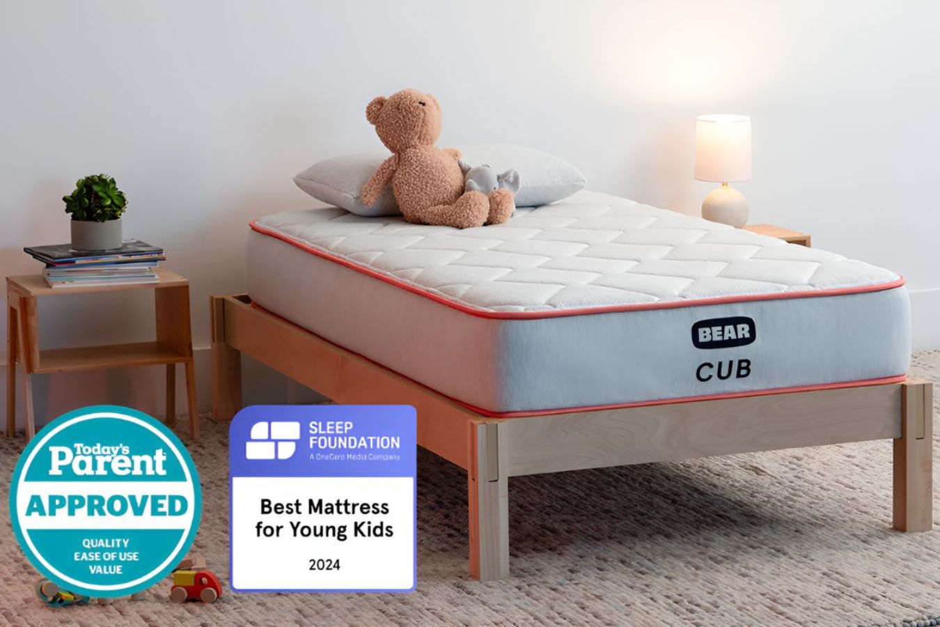 Bear Cub kids mattress on wooden bed frame with awards badges