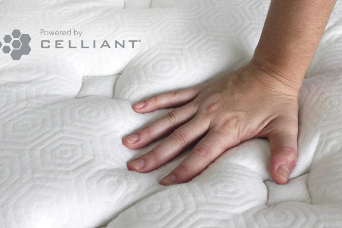 Hand pressing into Celliant cover demonstrating responsiveness