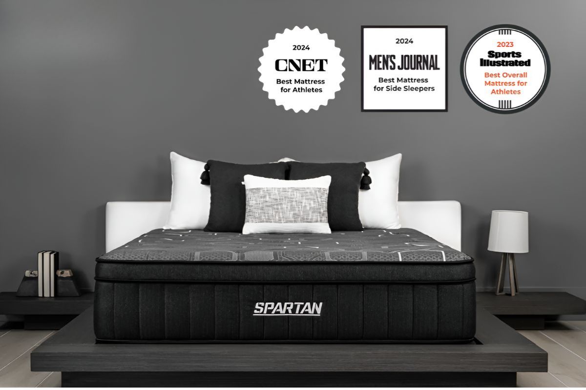 Brooklyn Bedding Spartan mattress with awards displayed on wall