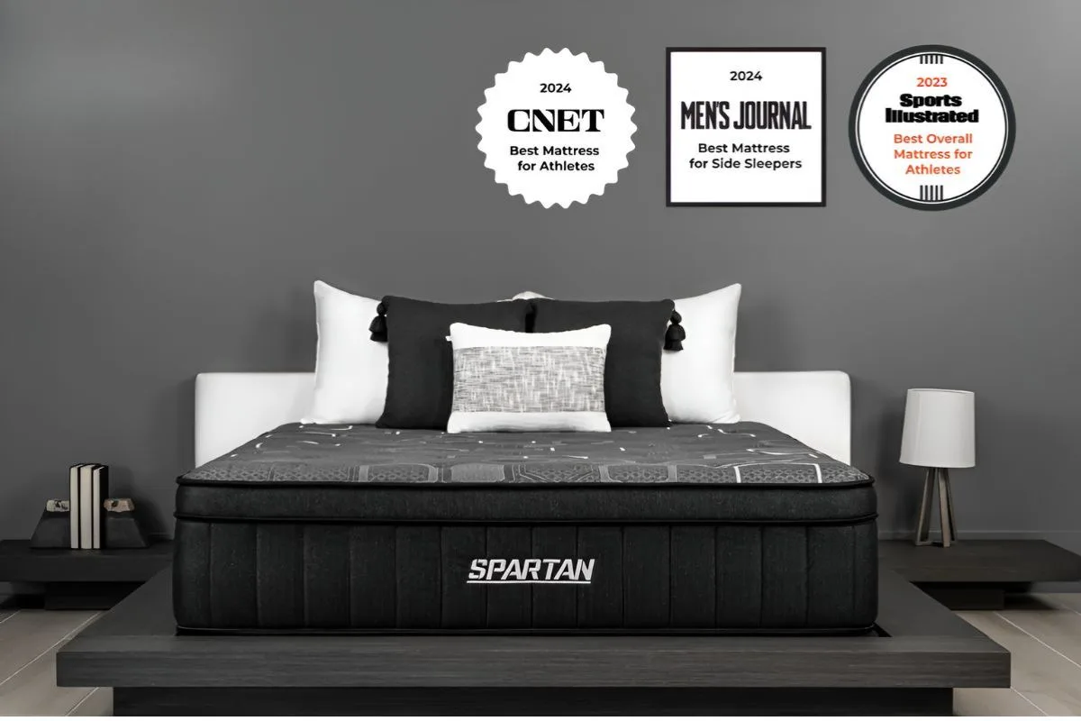 Brooklyn Bedding Spartan mattress with awards displayed on wall