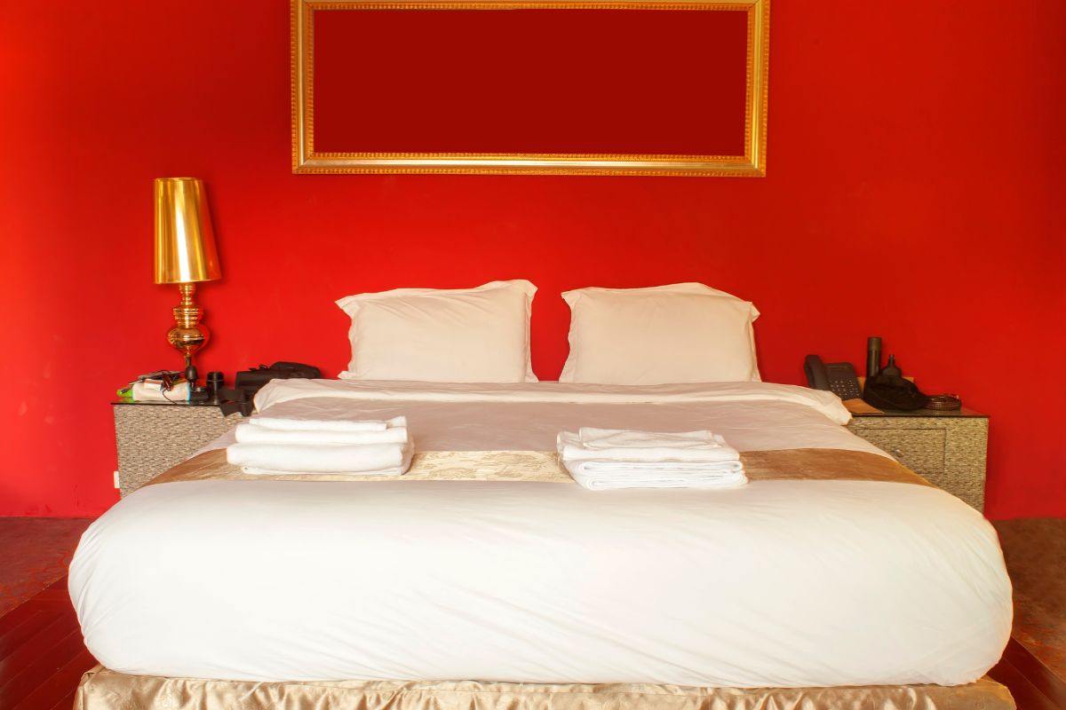 Queen size bed centered in a room showing standard mattress width and space for two sleepers